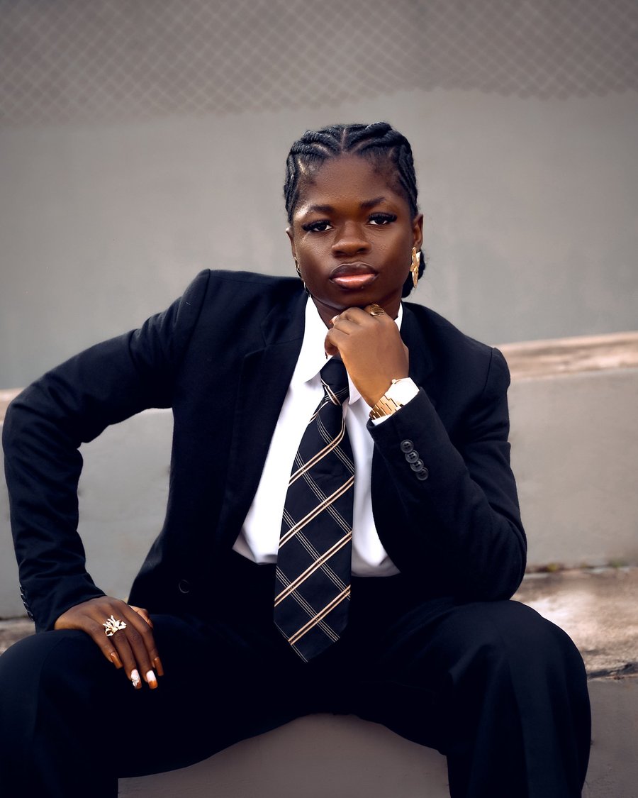Olubunmi Elizabeth seated in a black suit